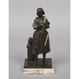 An early 20th century French patinated bronze figure of Joan of Arc. Raised on an associated