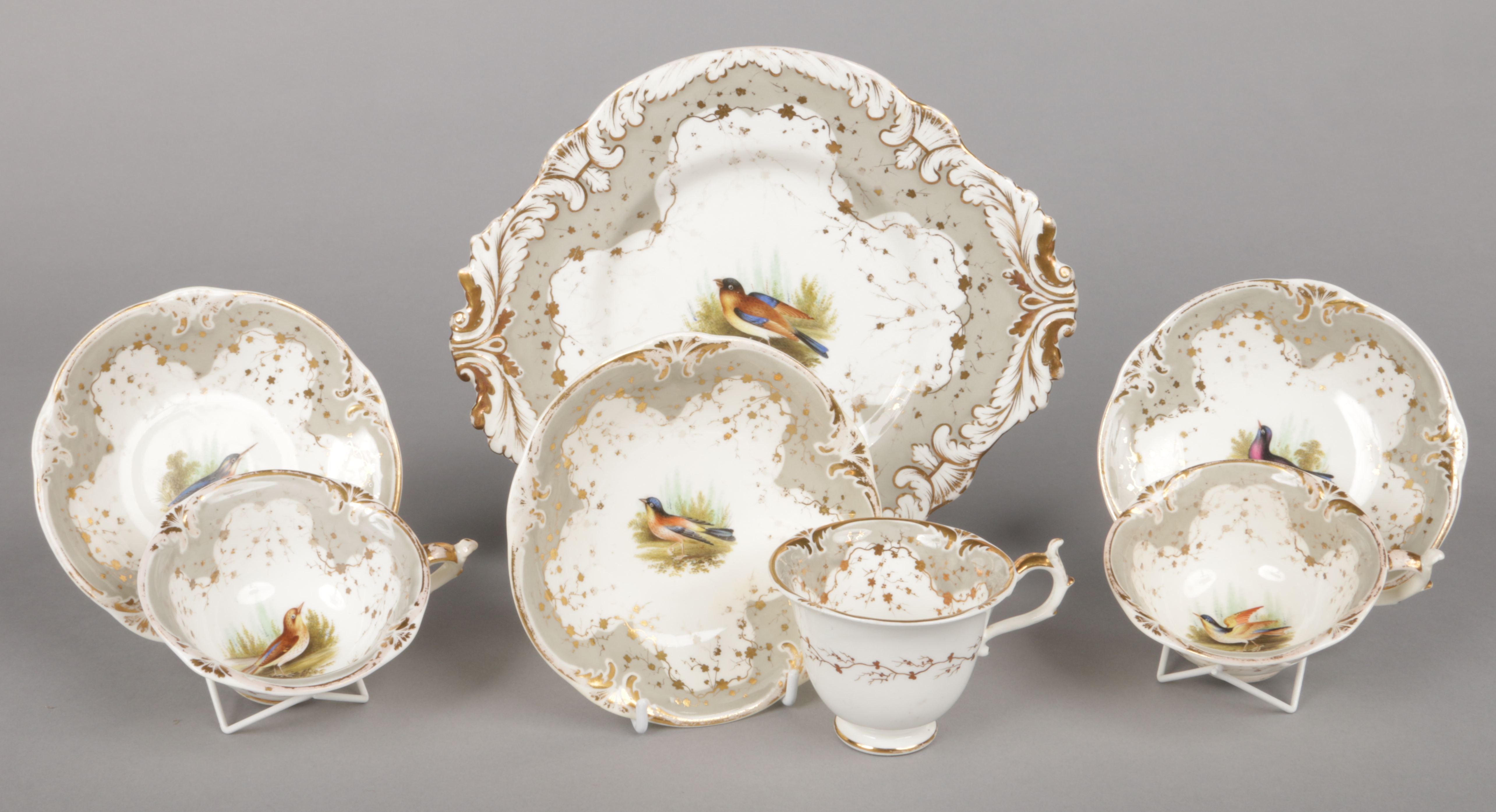 A quantity of Rockingham ornithological tea and coffee wares of Neo Rococo three spur type. With