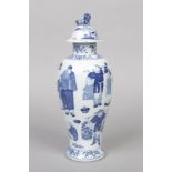 A Chinese blue and white baluster shaped jar and cover. Painted in underglaze blue with figures at