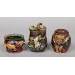 Two Japanese Sumida Gawa tobacco jars and a small flower pot. One jar formed as a crouching