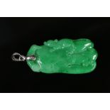 A Chinese spinach jade pendant with 18 carat white gold mount. Carved in the form of a gourd with