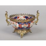 A Japanese Meiji period fluted Imari bowl with gilt metal mounts, 18cm wide. Condition report
