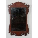 A mahogany framed pier mirror with strung inlay and fretwork pediments, 65cm.Condition report