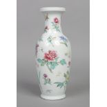 A Chinese Republic period baluster shaped vase. Painted in coloured enamels with scattered