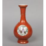 A 19th century Chinese rouge de fer baluster vase. Decorated with gilt key fret borders and flower