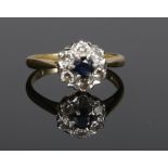 An 18 carat gold diamond and sapphire cluster ring. Size L.Condition report intended as a guide