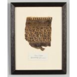 A framed fragment of Coptic textile, Egypt 6th century. Label reads Tissu Copte, Egypte VIe