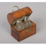A 19th century tan leather mounted dome top scent casket. With brass handle and fitted with a pair