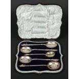 A Victorian cased set of four silver berry spoons and sifting spoon by Walker & Hall. Engraved