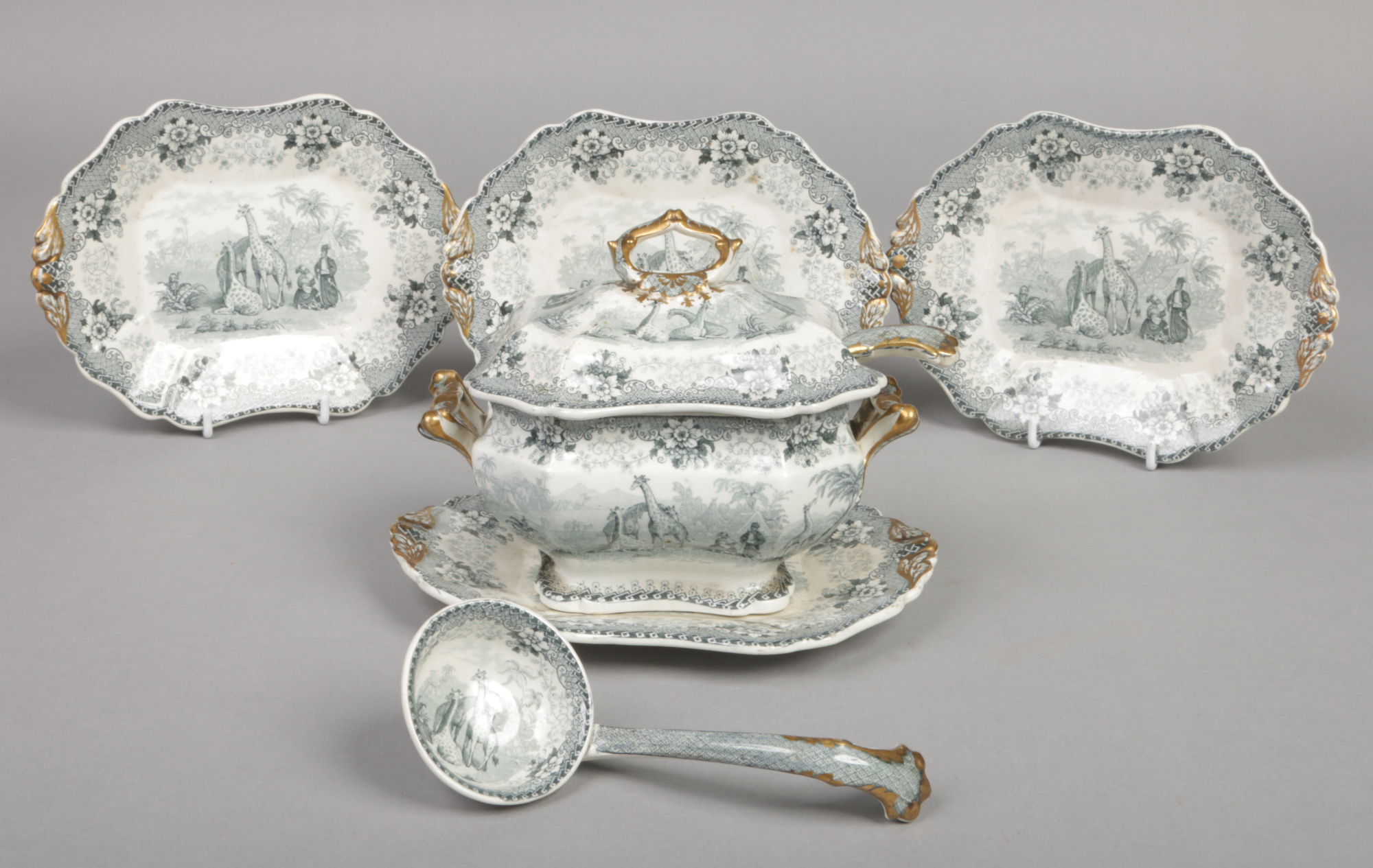 A John Ridgway sauce tureen, cover and stand, along with three more stands and two ladles. Printed