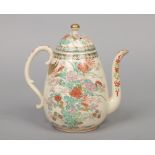 A Japanese Meiji period Satsuma coffee pot and cover of pear form. With scrolling handle and painted