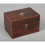 A George III mahogany tea caddy with strung inlay and silver mounts. Fitted with a pair of tea boxes