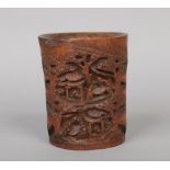 A Chinese carved bamboo bitong. Decorated to one side with a mountainous village scene with