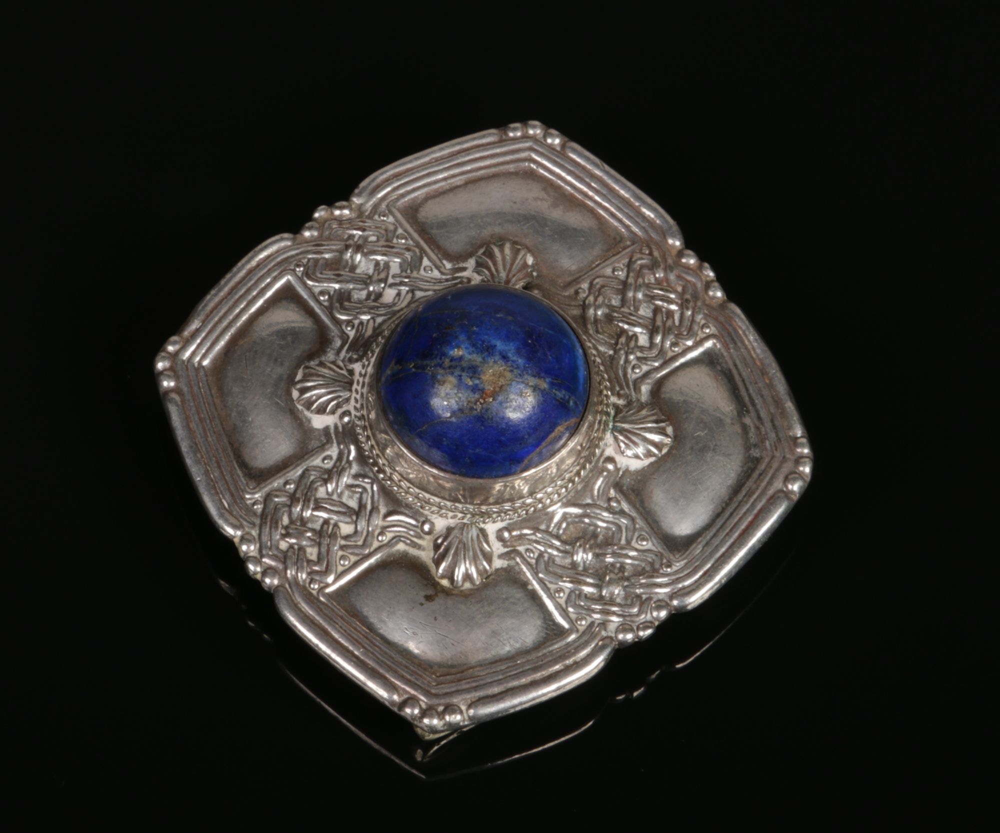 A Scottish white metal brooch / buckle of square Celtic form and set with a large lapis lazuli