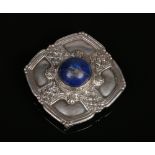 A Scottish white metal brooch / buckle of square Celtic form and set with a large lapis lazuli