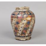 An antiques Persian earthenware jar painted in coloured enamels, 19cm.Condition report intended as a