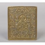 A 19th century Russian bronze relief cast domestic icon decorated with Saints and having Cyrillic