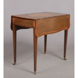 A George III harewood butterfly wing Pembroke table with single drawer. Having figured mahogany oval