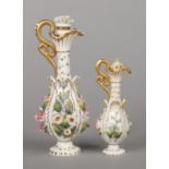Two Rockingham snake-handled ewers. Each with a coiled serpent forming the handle, having a baluster