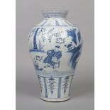 A Chinese Wanli style baluster shaped blue and white vase. Painted in underglaze blue with a