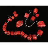 A quantity of natural red coral beads.