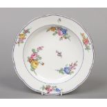 A Sevres soup plate. Painted with bouquets and scattered sprigs under blue line and gilt hatch