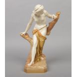 A Royal Worcester figure, the Bather Surprised after Sir Thomas Brock. The semi clad figure is
