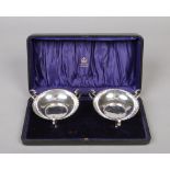 An Edwardian cased pair of silver bon bon dishes by Elkington and Co. Each with gadrooned rim and