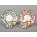 Two Minton small coffee cans and saucers with double scrolling handles. Painted in the Sevres