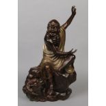 A Chinese bronze statue. Formed as a ferocious howling demon holding a pearl and seated on a