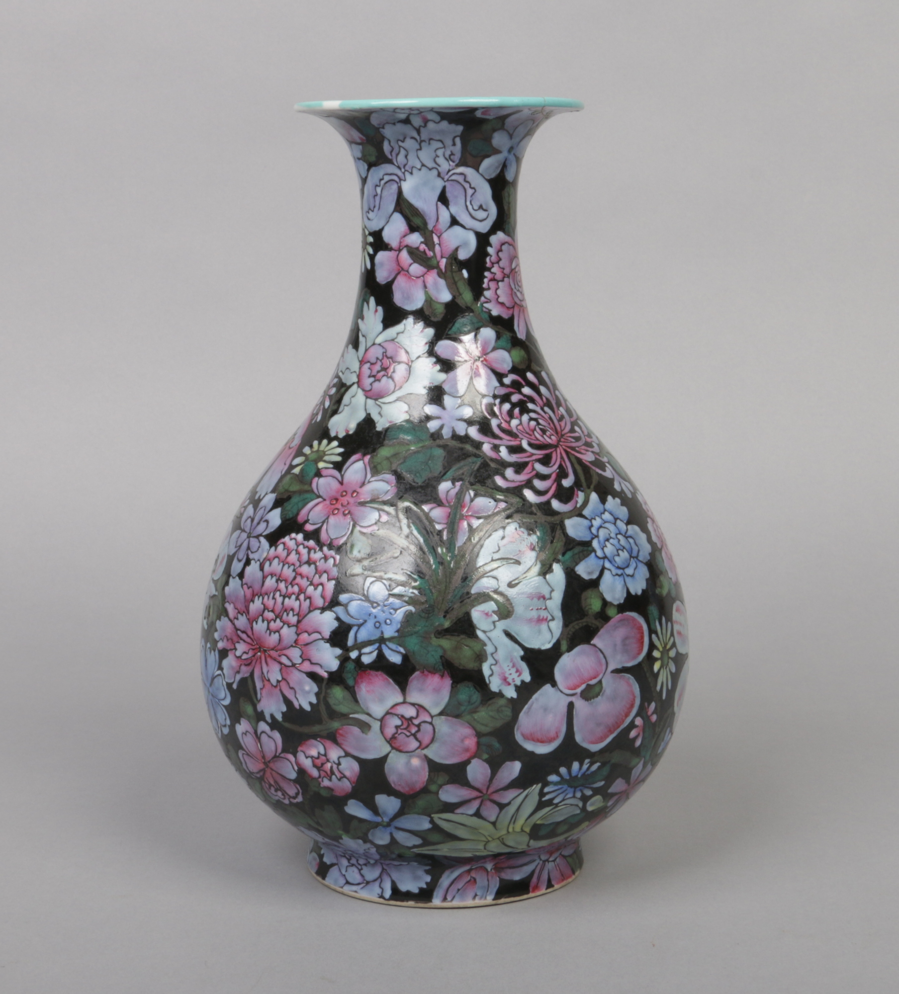 A Chinese famille noir pear shaped vase. Decorated in coloured enamels with mixed flowers and with