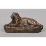 After Antoine-Louis Barye (French 1795-1875) a bronze sculpture of a reclining panther. Signed Barye