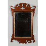 A mahogany and parcel gilt framed pier mirror with fretwork pediments, 69cm.Condition report