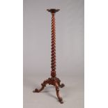 A Victorian rosewood torchere. With twist carved column raised on a tripod cabriole base, 165.5cm.