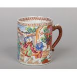 An 18th century Chinese export porcelain tankard with scrolling dragon handle. Decorated in coloured