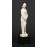 A. Boulard (French) an Art Deco carved ivory figure of a maiden draped in a robe and holding a