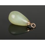A carved celadon jade pear formed pendant with yellow metal mount, 35mm.Condition report intended as