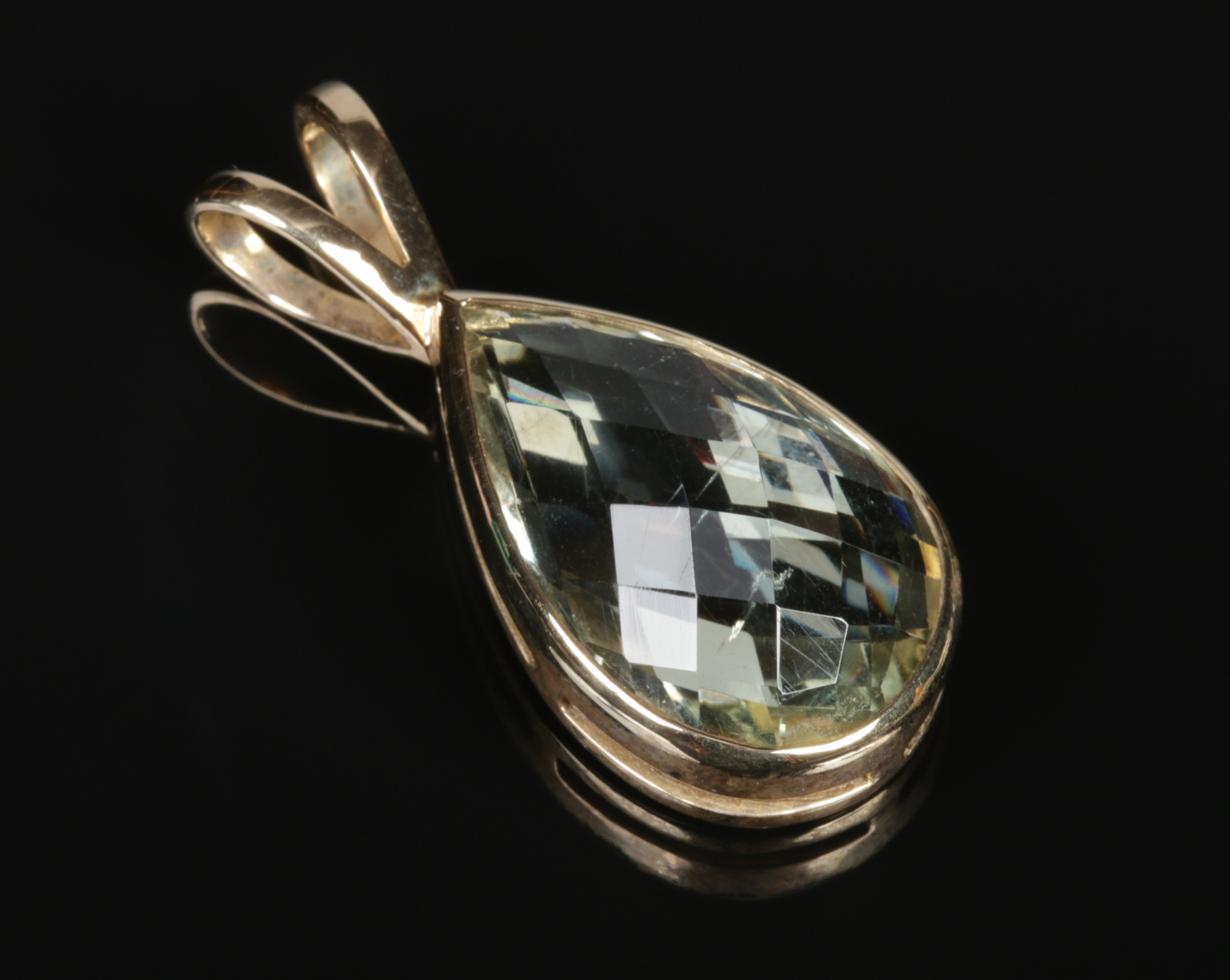 A 9 carat gold mounted faceted topaz pendant of teardrop form, 7.4 grams gross, 38mm.Condition