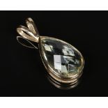 A 9 carat gold mounted faceted topaz pendant of teardrop form, 7.4 grams gross, 38mm.Condition