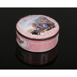 An 18th century enamel circular powder box with hinged cover. Pink ground, with raised white enamel,
