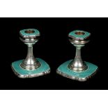 A pair of George V silver dwarf candlesticks by Walker & Hall. Decorated with turquoise guilloche