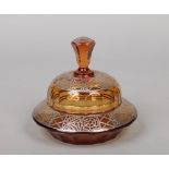 An Art Deco cut amber glass bon bon dish and cover with silver overlay decoration and faceted