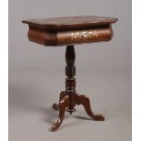 A Victorian centre pedestal rosewood work table. With canted rectangular top ornamented with