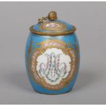 A French Sevres style jar and cover of barrel form and with gilt metal mounts. Blue celeste