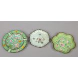 Three Cantonese enamel dishes. Green ground and decorated with dragons, one incorporating a