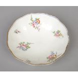 An 18th century Sevres lobed salad bowl. Painted with flower bouquets and scattered sprigs under a