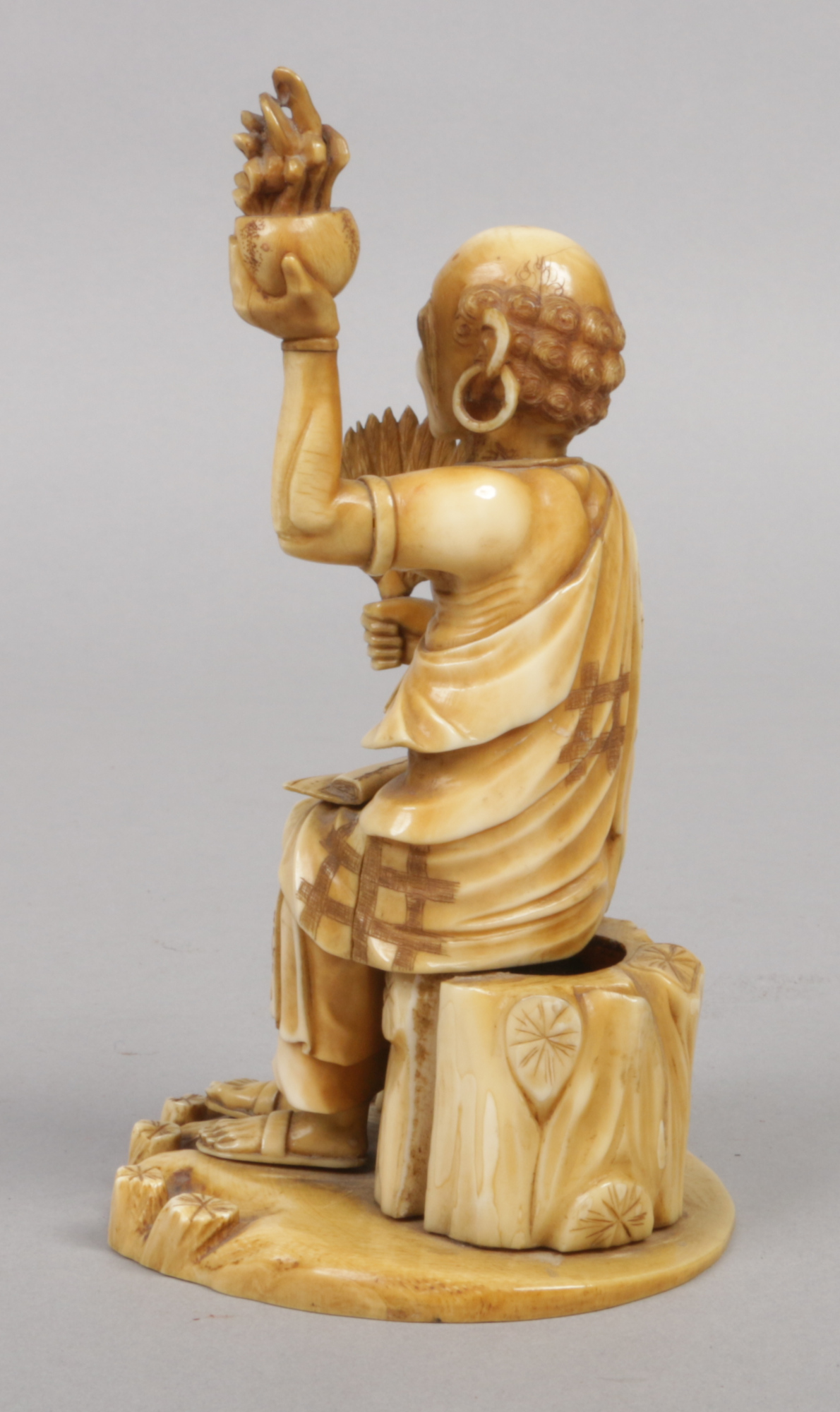 A Japanese Meiji period carved ivory okimono. Formed as a seated sage. Signed with a lacquer - Image 5 of 6