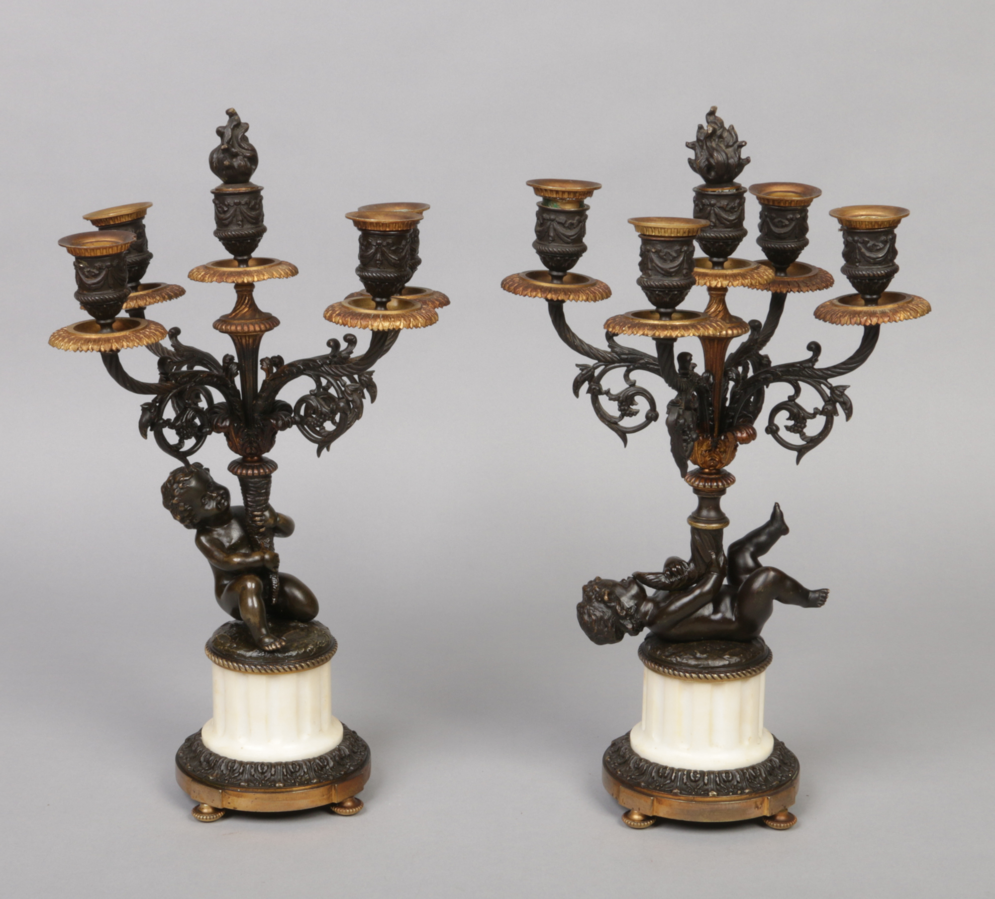 A pair of 19th century French bronze and alabaster figural five branch candelabra. With gilt