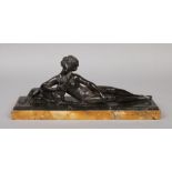 An Art Deco bronzed spelter figure of a reclining maiden and a hound raised on a stepped rectangular