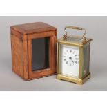 A French brass carriage clock in fitted leather case, 14cm. Condition report intended as a guide